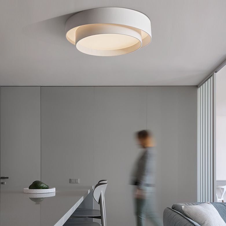 Quinn white ceiling light above a modern desk and seating area.