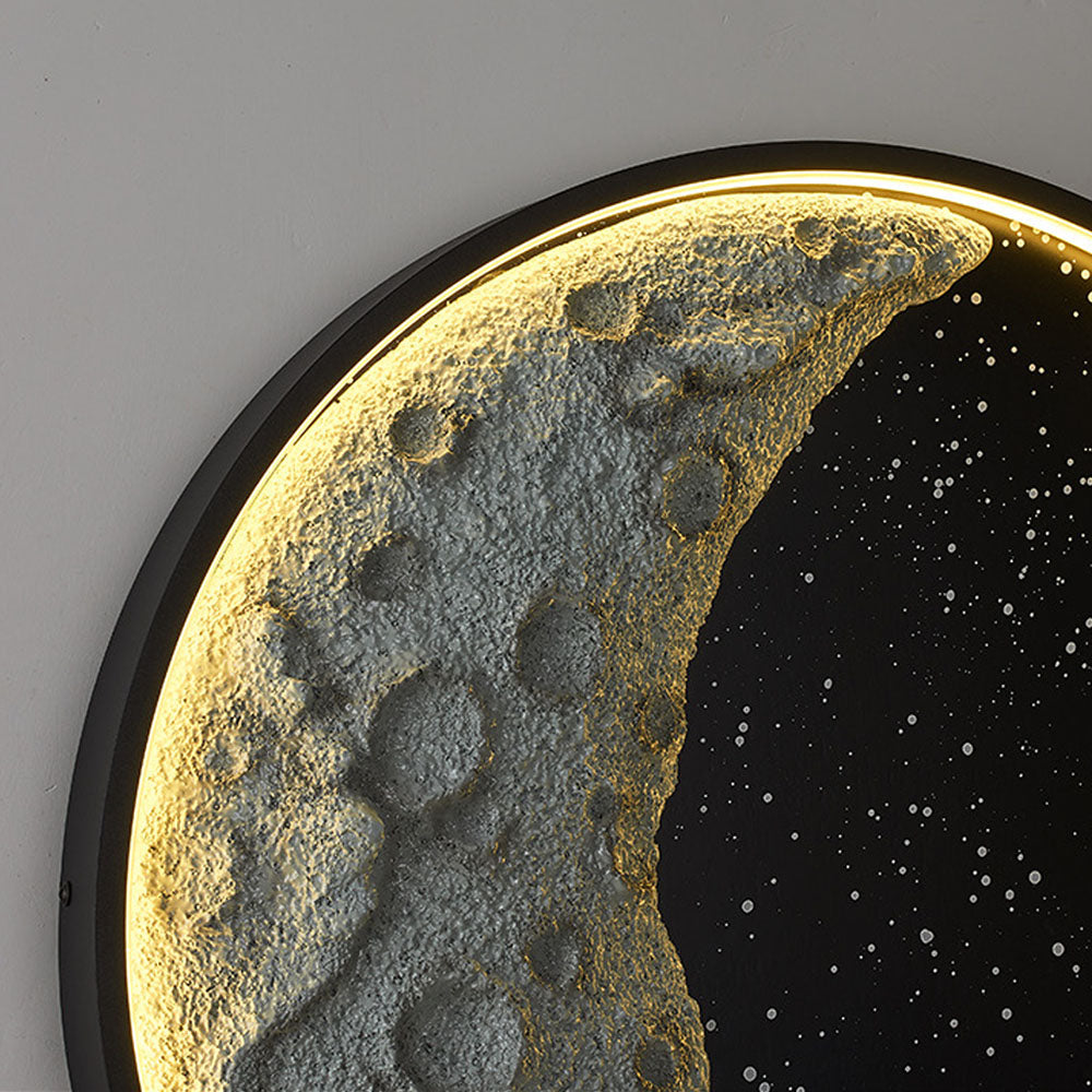 Close-up of Elif crater-textured gray crescent, speckled black field, black rim and illuminated edge
