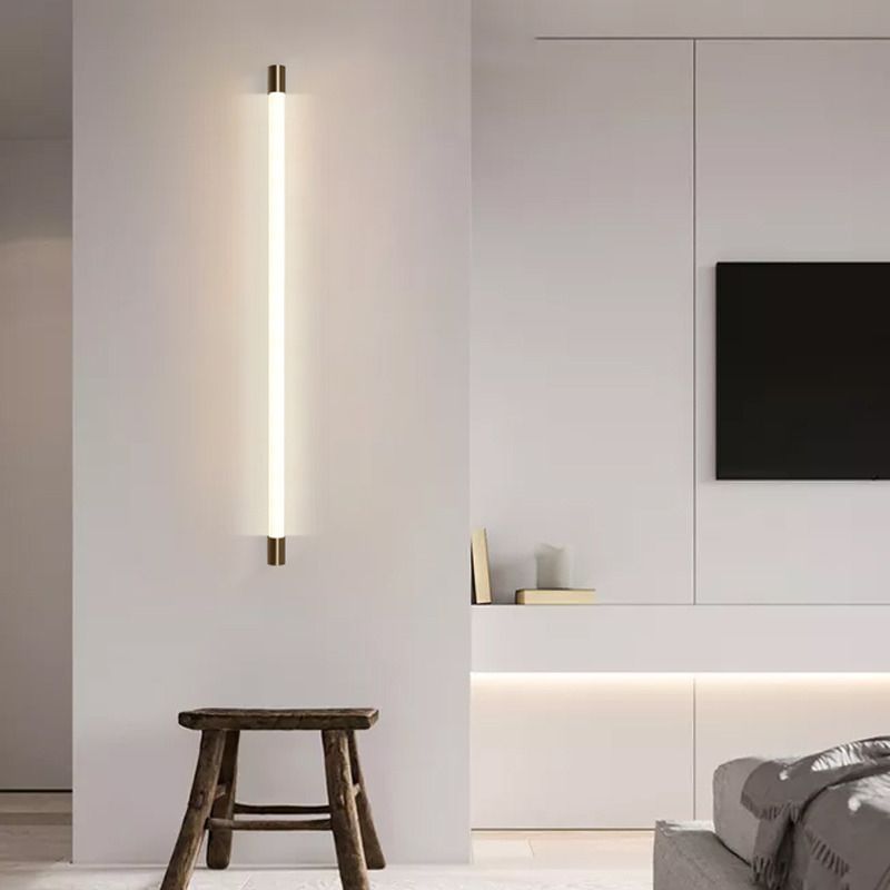 Vertical Gold-accented Edge light beside a bed