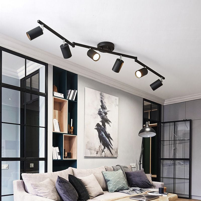 Black Freja six-head spotlight above a grey sofa