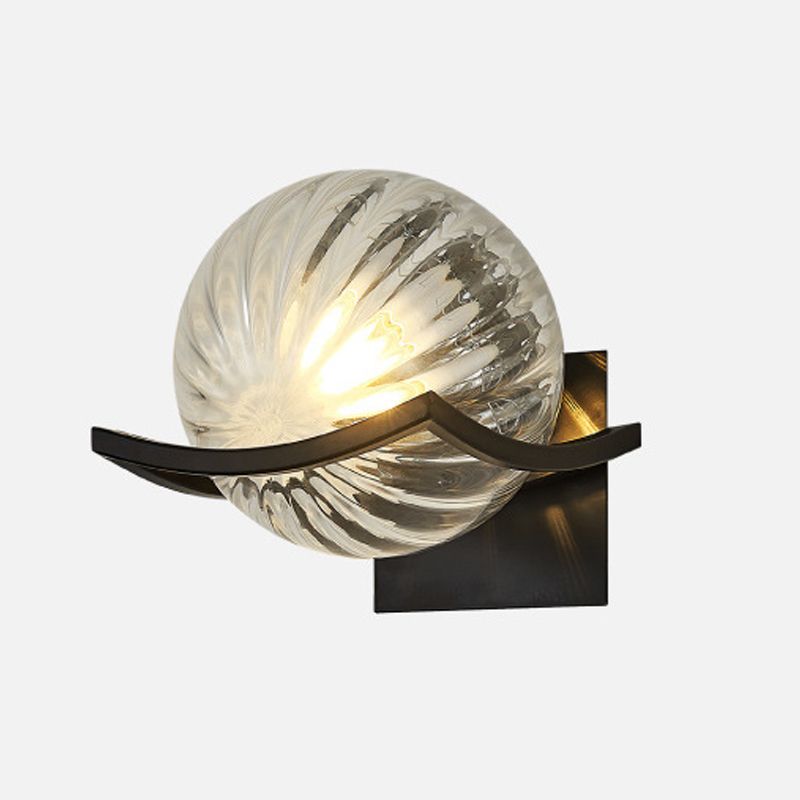 Valentina spiral-ribbed clear-glass globe wall lamp in an isolated view