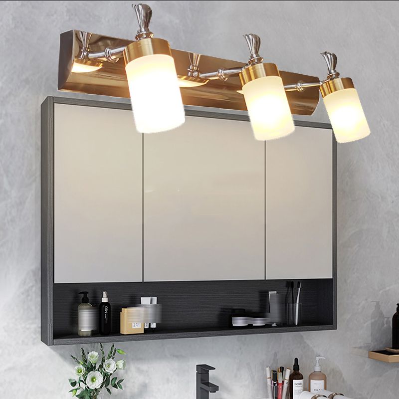 Leigh three-head vanity light above a bathroom mirror