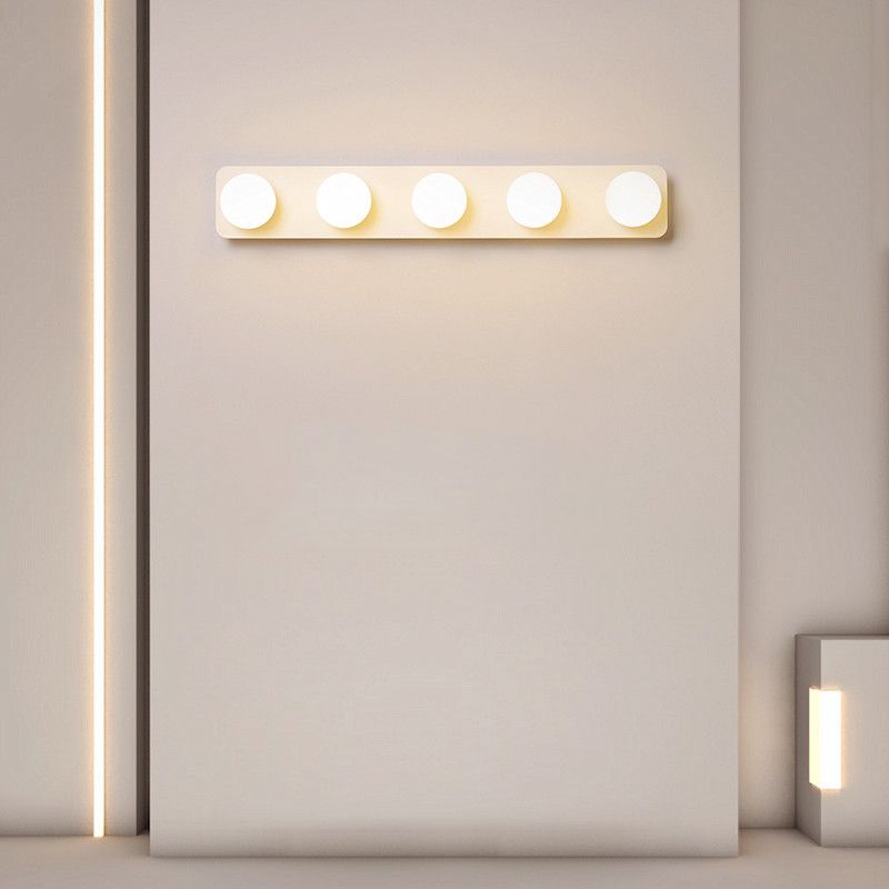 Valentina white five-light bar illuminated on a wall