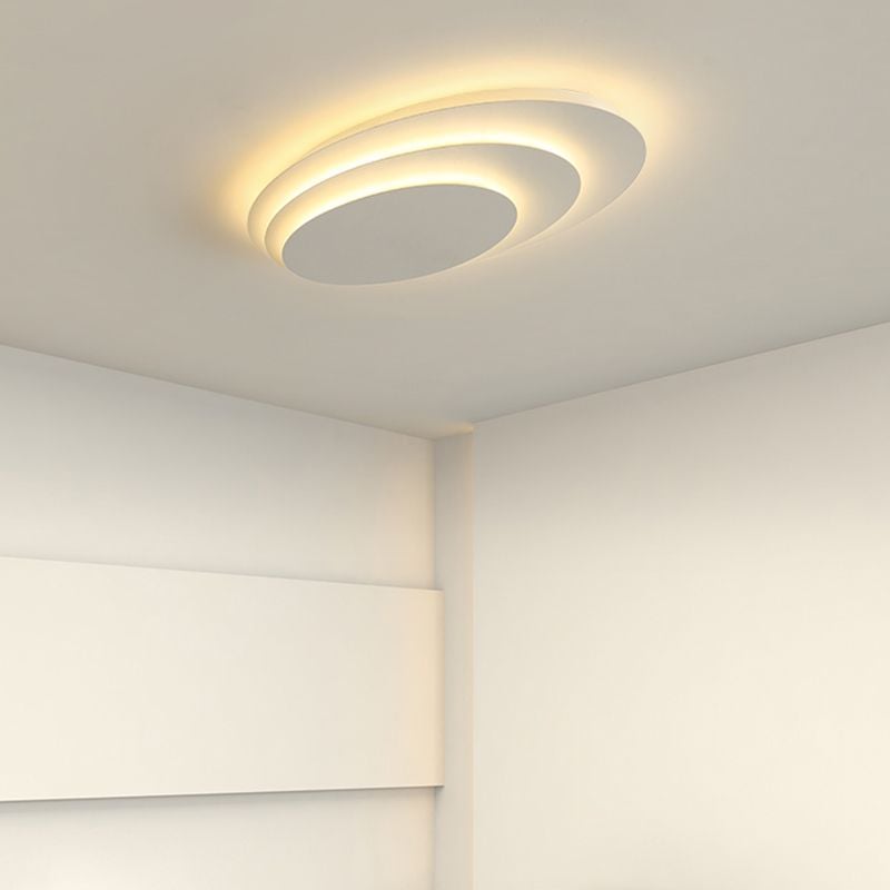 Quinn Style B offset circular ceiling light above a bed