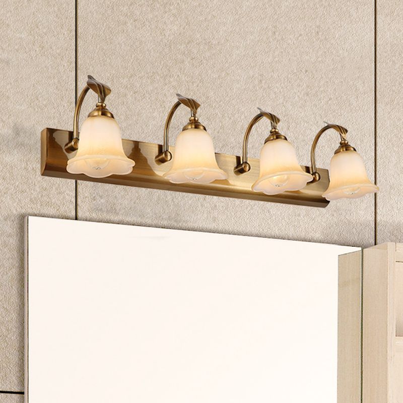 Four pale flower shades on a Gold wall-light backplate