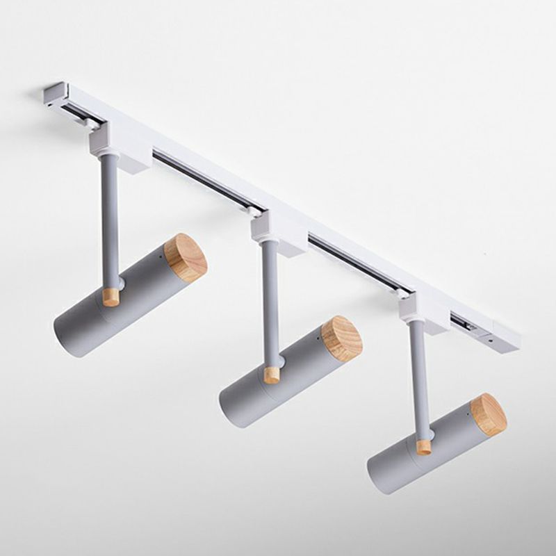 Gray three-head ceiling spotlight with wood caps and light ceiling rail