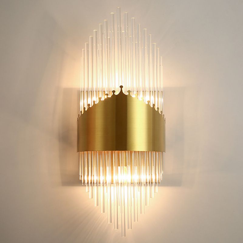 Kristy I stepped clear rods with a crown-edged gold-tone central band on a pale wall