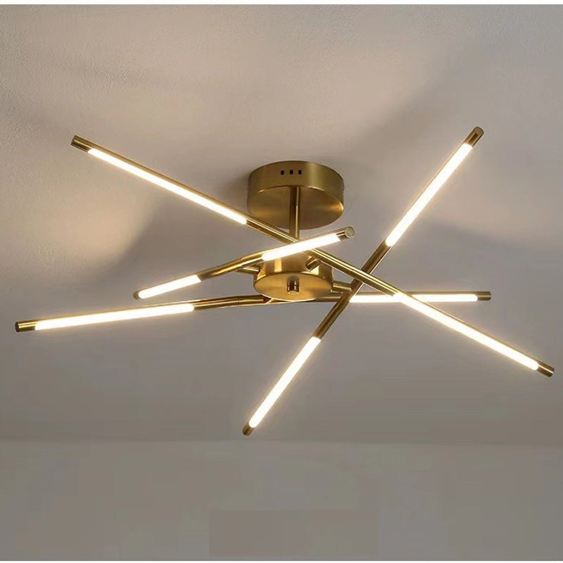 Gold ceiling light with crossing luminous bars, metal tips, short stem and round canopy