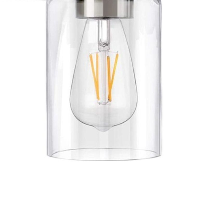 Close-up of Alessio clear cylindrical glass shade around a filament-style bulb beneath a reflective collar