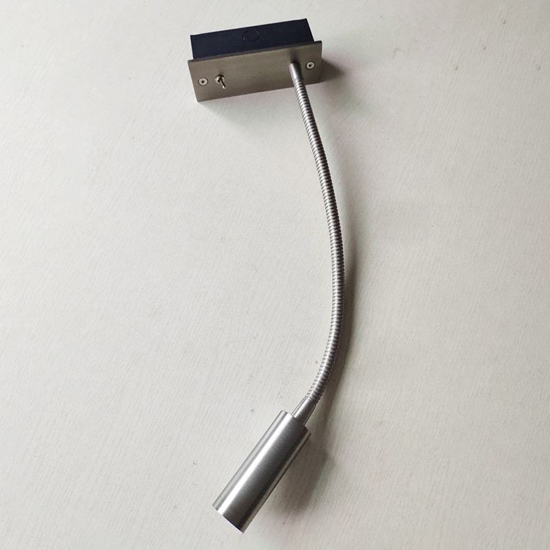 Orr metal gooseneck reading lamp shown with its cylindrical head pointing downward.