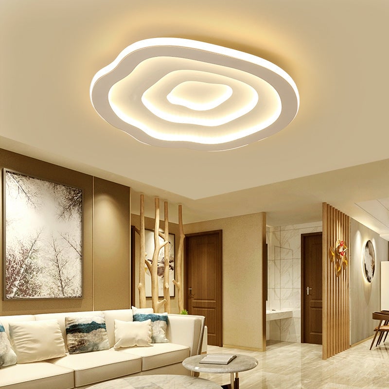 Warm Quinn Ripple ceiling light above a sofa