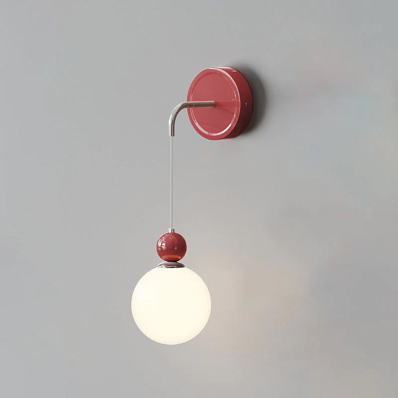 Red Model C globe suspended below a round wall plate