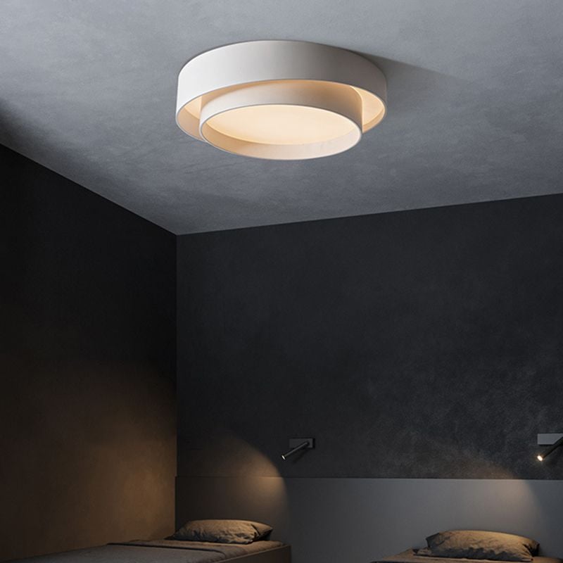 Quinn layered white ceiling light in a bedroom with dark walls.