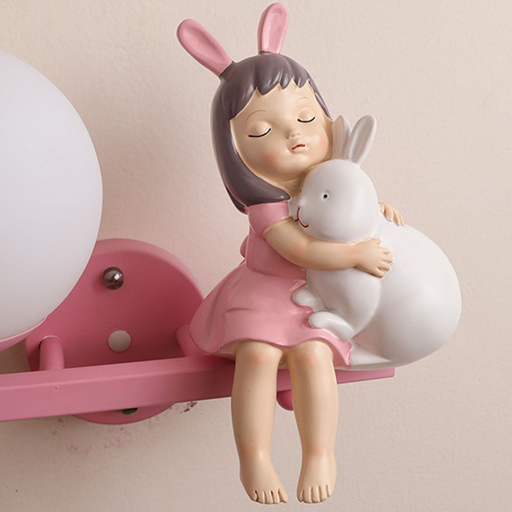 Close view of Minori girl holding a rabbit on the bracket