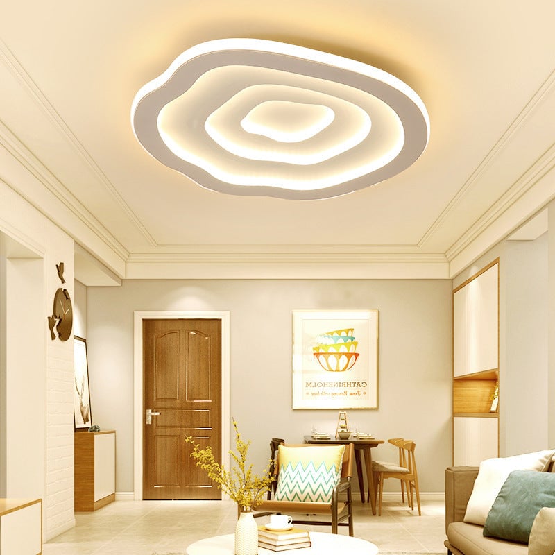 Warmly illuminated Quinn Ripple light above a living area