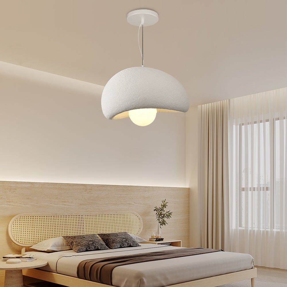 White cloud dome pendant above a bed