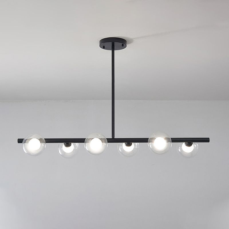 Close black six-globe pendant with upright suspension and round canopy against a pale ceiling