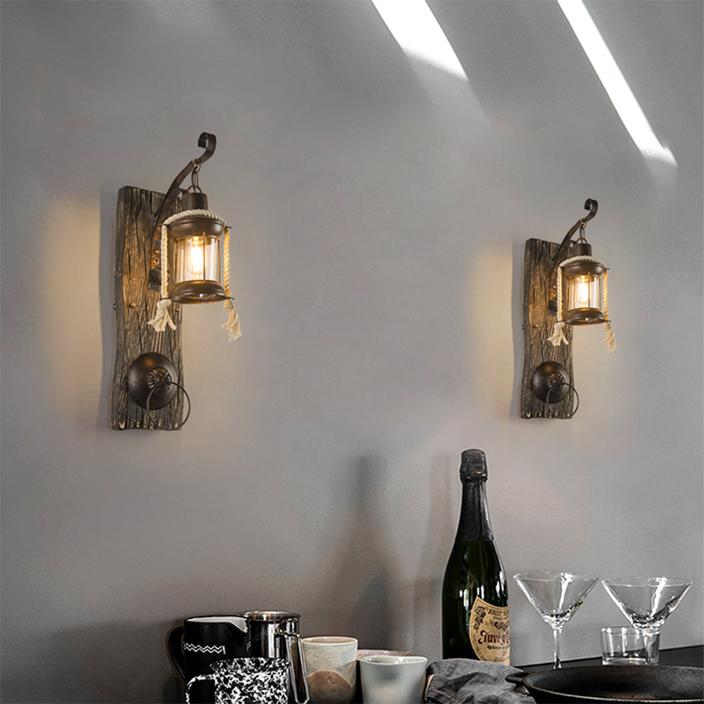 Two Alessio lantern wall lamps above a dining setting
