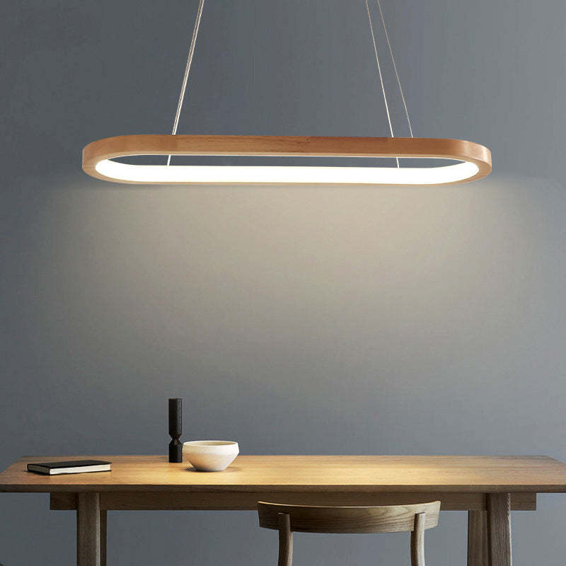 Ozawa illuminated oval pendant over narrow table