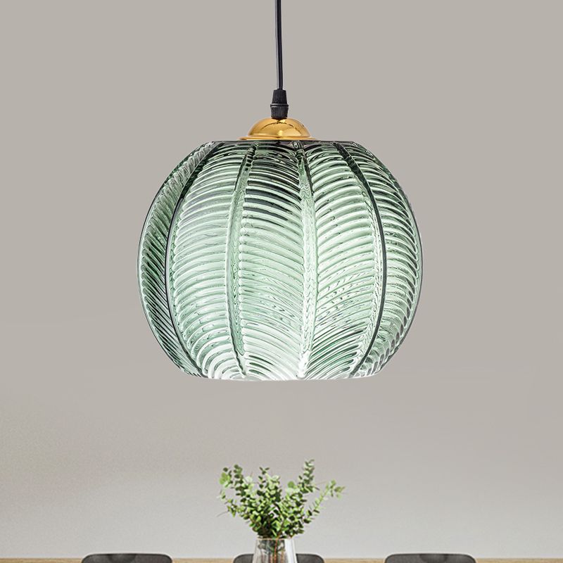 Close view of Hailie ribbed green glass shade and gold-tone top fitting.