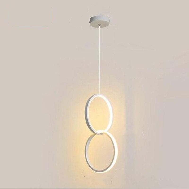 Two vertically stacked white circular light elements suspended below a round white canopy