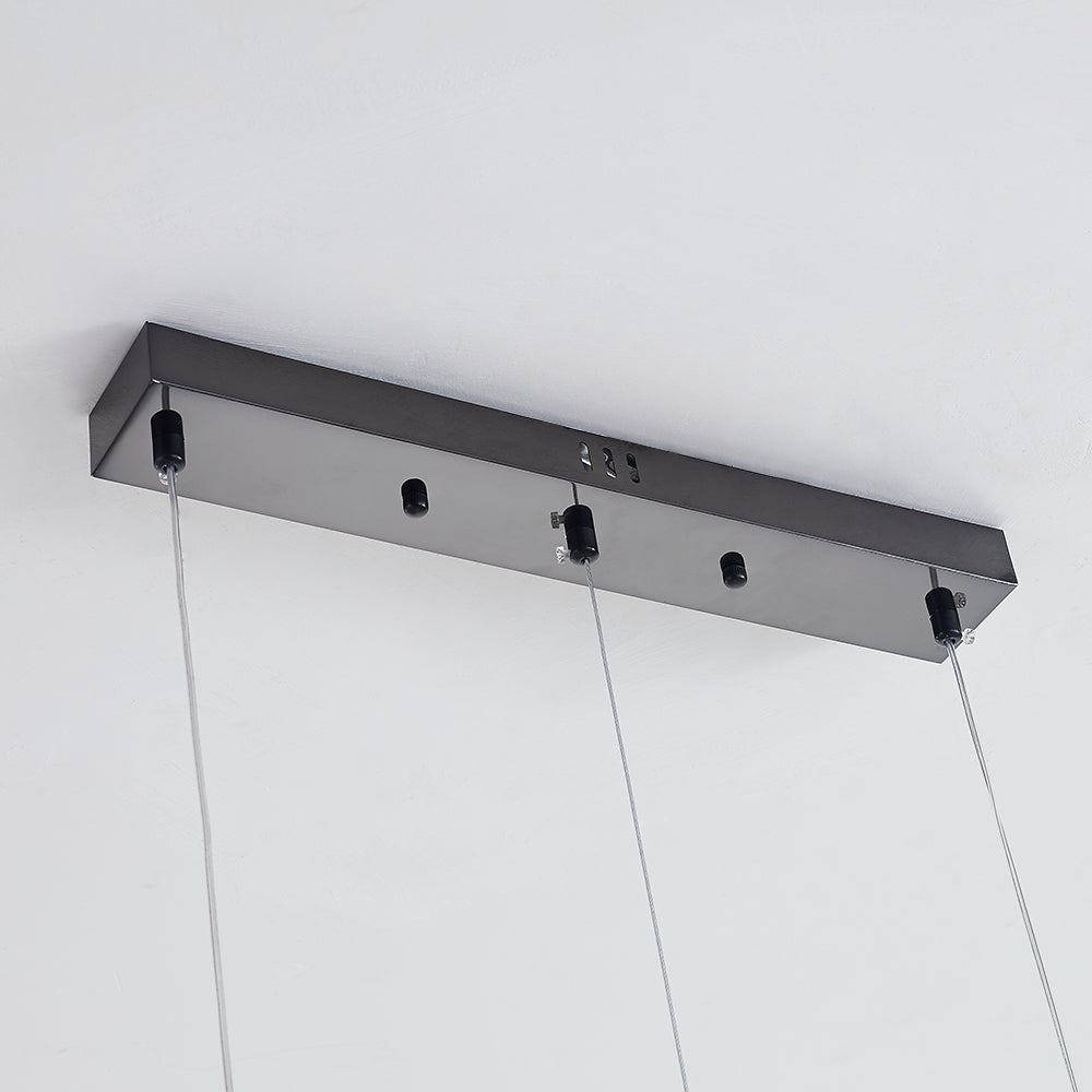 Underside of black canopy with multiple hanging cables