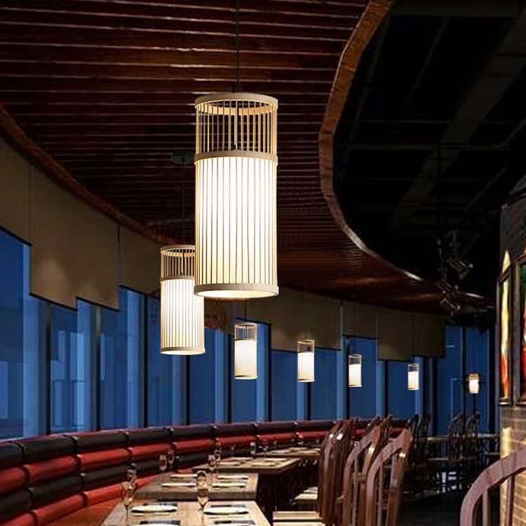 Wood-colour Ozawa pendants beneath a dark timber ceiling beside a red bench