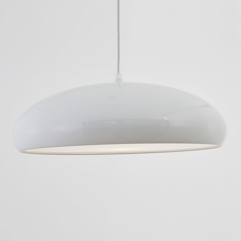 Side detail of the white dome pendant showing its shallow profile and cord entry