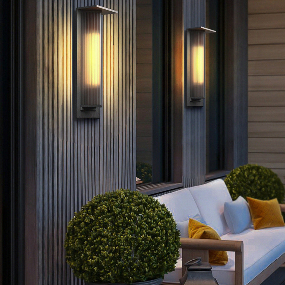 Two Orr ribbed wall lamps beside outdoor patio seating