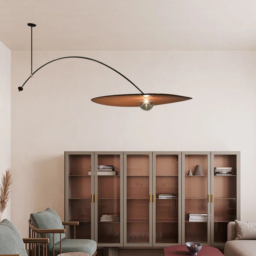Carins long arc pendant above shelving in a living room