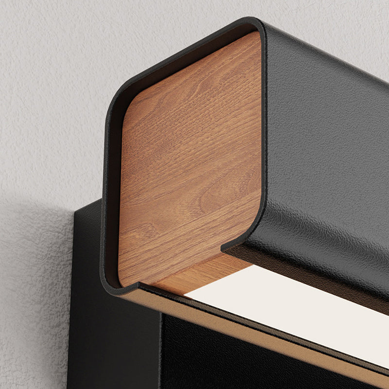 Black Aqsa bar-end closeup with woodgrain panel, rounded metal shell and white diffuser