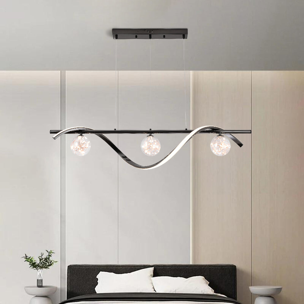 Black Louise pendant with three globes above a bed