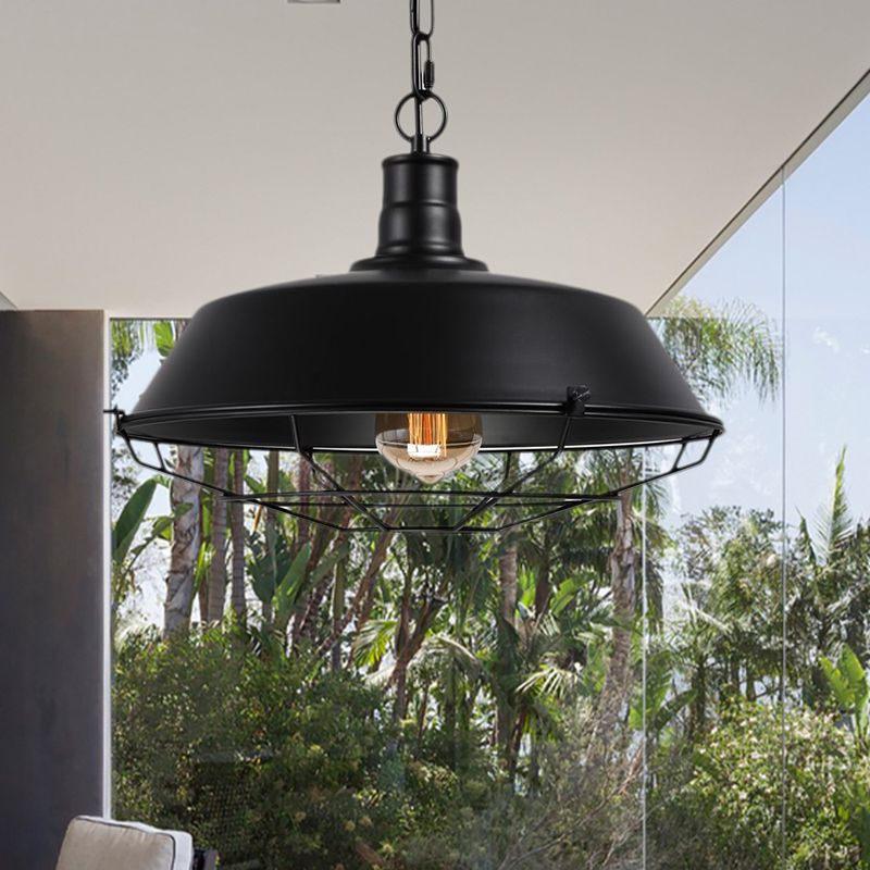 Black cage pendant beside a large window