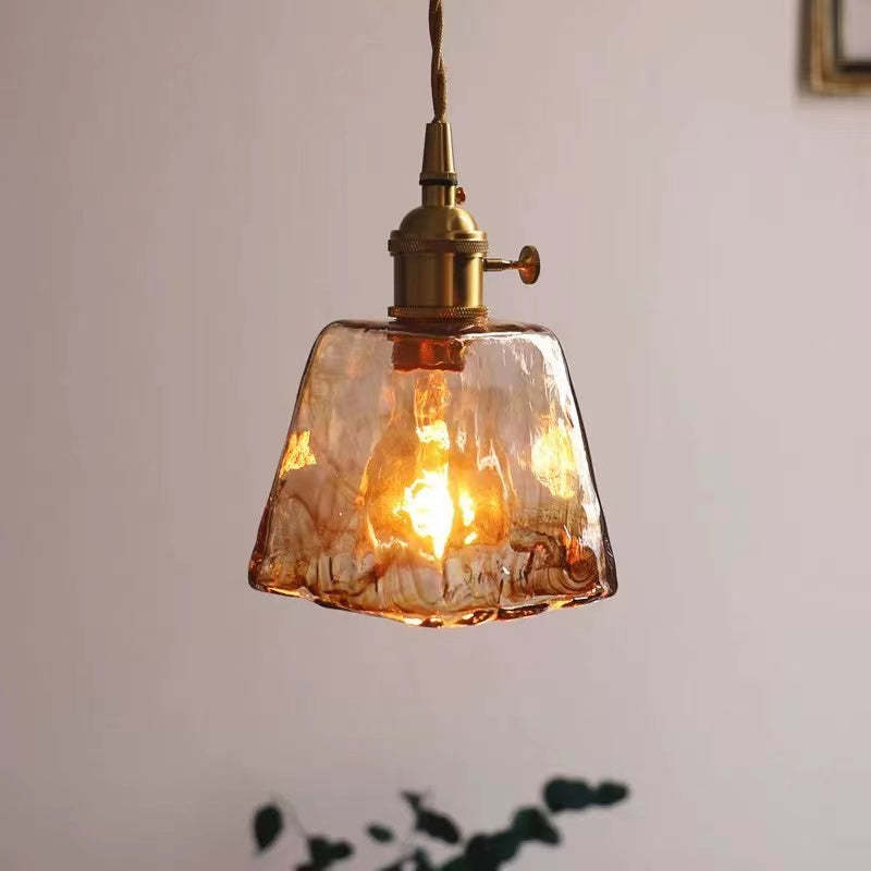 Levy A lit tapered textured glass shade with a brass-tone fitting