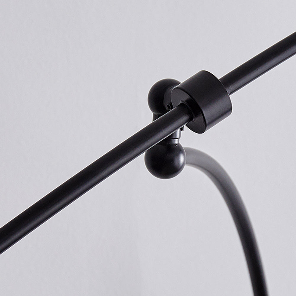 Close view of curved black arm attachment and light cord