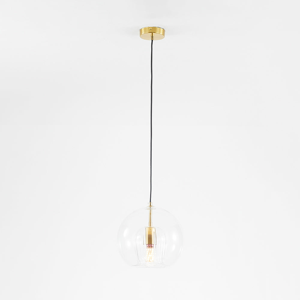 Clear globe pendant with a long black cord and round gold-tone canopy against white
