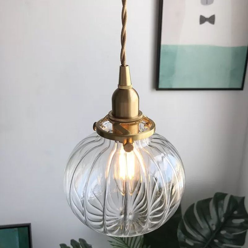 Close view of Clear Valentina glass globe and gold-colour fitting