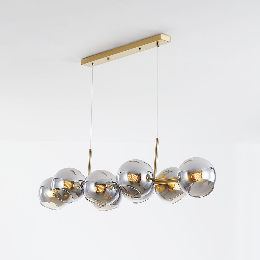 Gold-tone Valentina canopy and suspension lines above a linear bar with reflective gray-looking globes