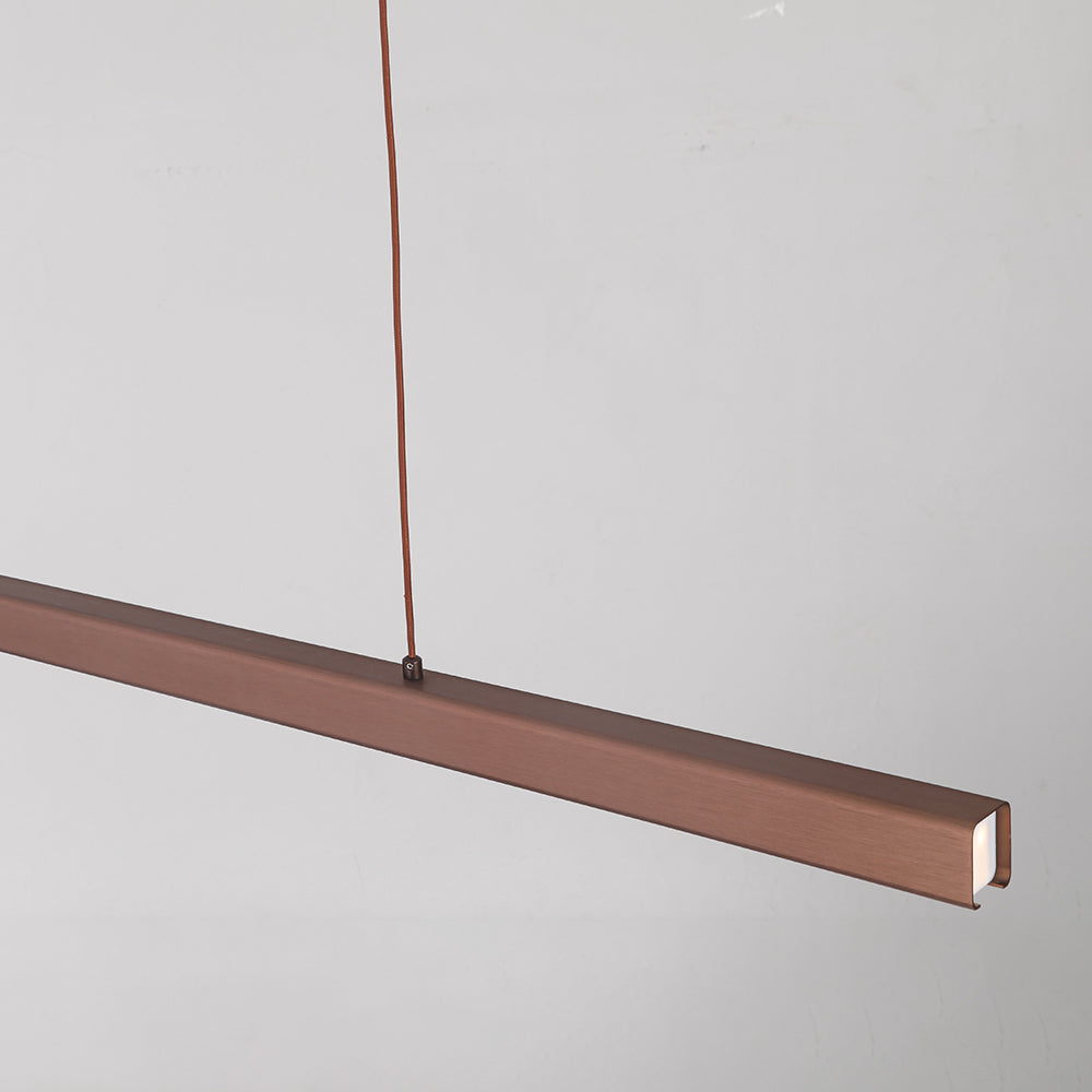 Brown Edge housing close-up with brushed finish, glowing end diffuser and top cord attachment