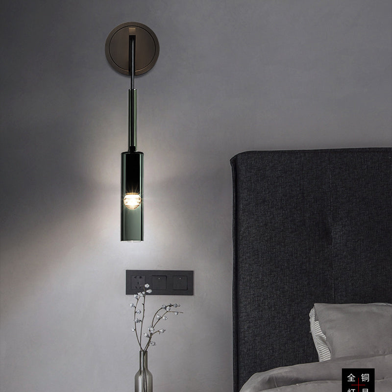 Sanna black wall light beside a headboard