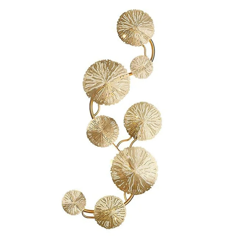 Isolated vertical eight-leaf gold-tone wall light with varied disc sizes on curved stems
