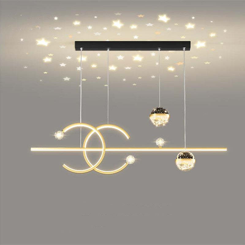 Gold Madina pendant with star patterns pictured across the ceiling