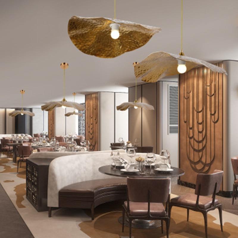 Several leaf pendants across dining interior