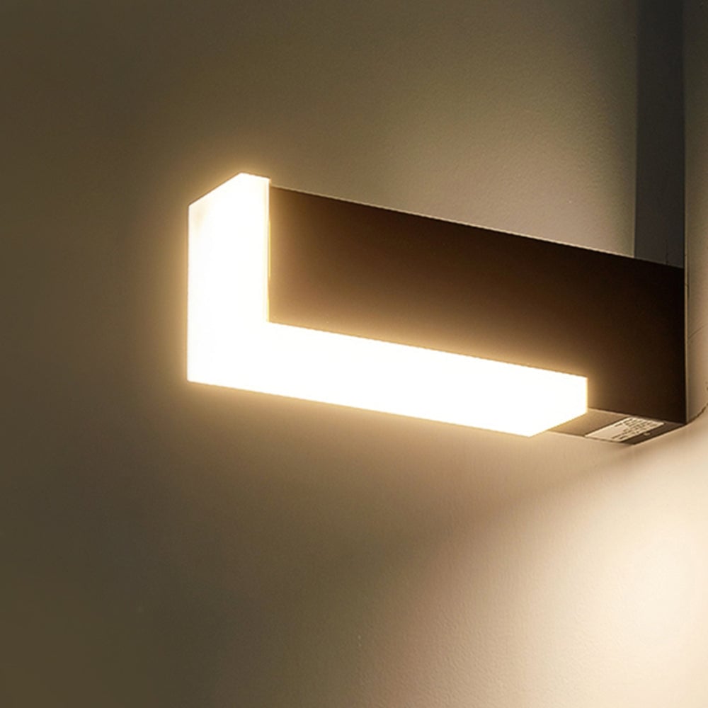 Close view of horizontal black Orr wall fixture with white lit edge