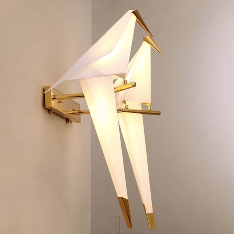 Oblique close view of the double-bird Clifford wall light, showing overlapping angular wings and two perches