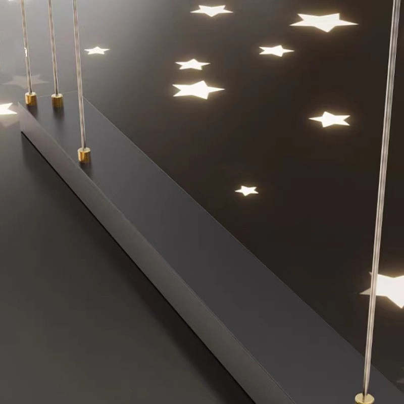 Close-up of Madina long black canopy, suspension attachments and star-shaped ceiling light patterns