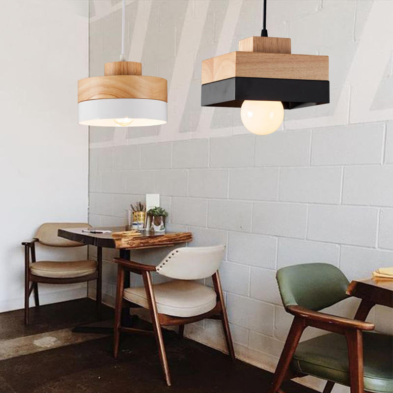 White round and black square Morandi pendants above cafe tables