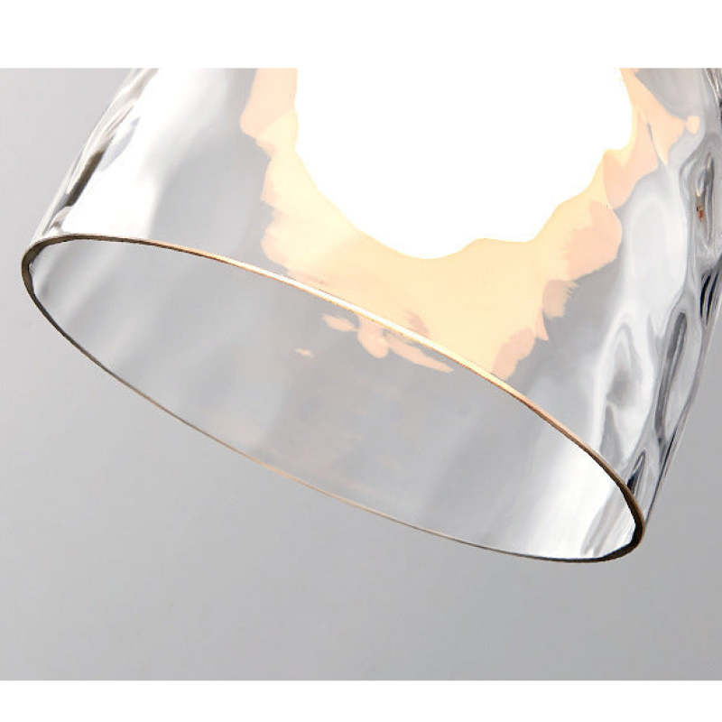 Close view through clear patterned glass rim to bulb