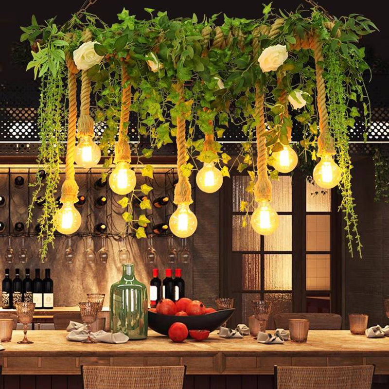 Nest eight-head greenery pendant above a bar counter with bottles
