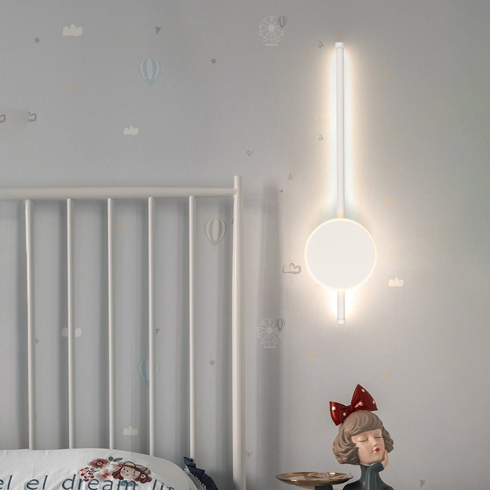 White Edge light mounted vertically beside a headboard